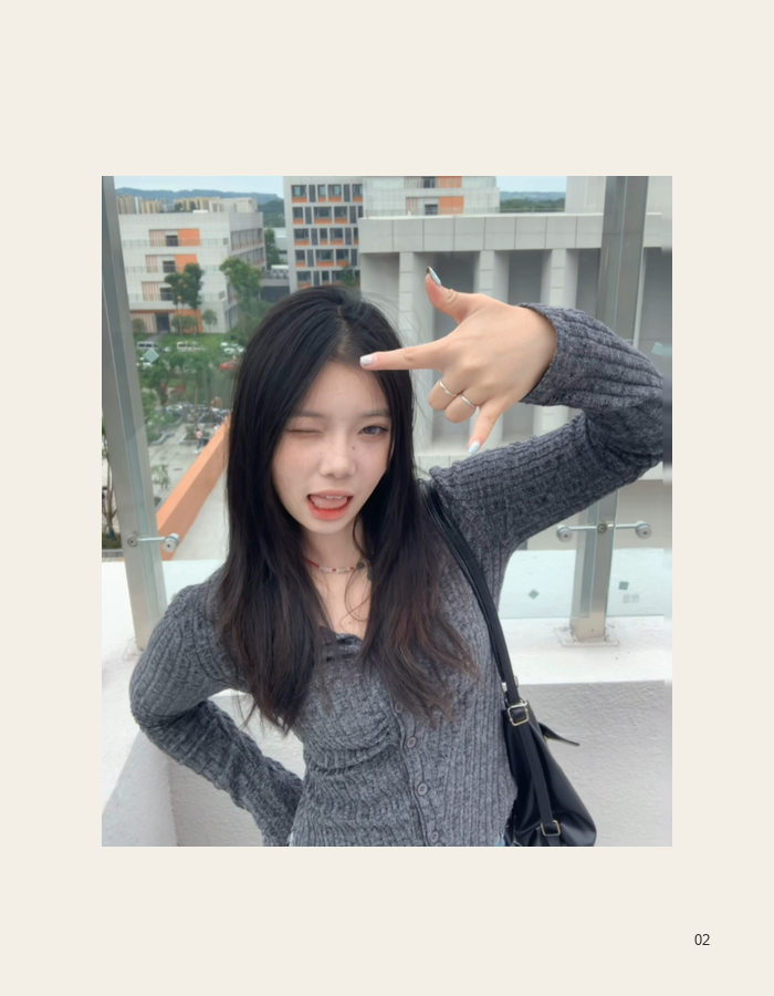 Portrait at a transit center with a raised hand