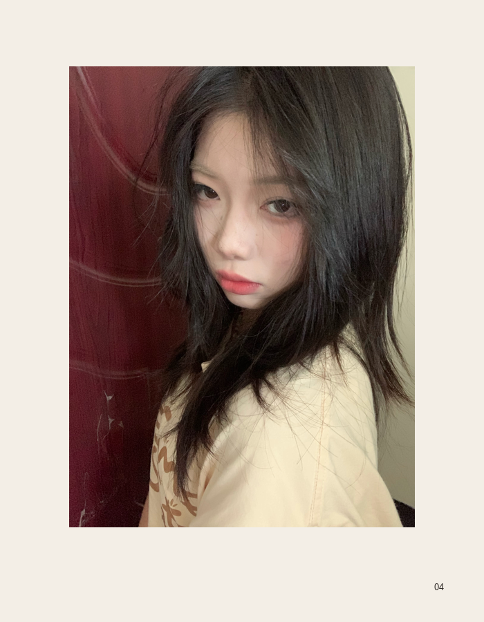 Close cream portrait beside a deep red wall