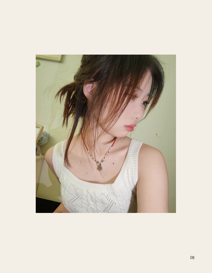 Quiet profile in a cream knit top