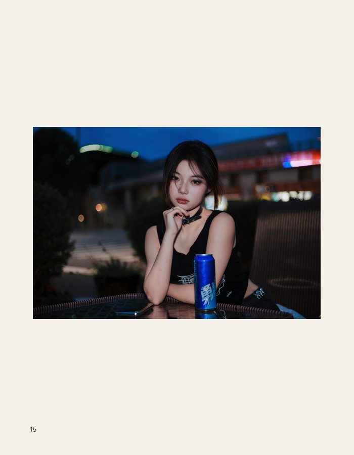 Seated nighttime portrait at a table