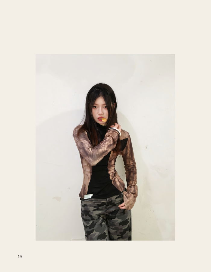 Fashion portrait against a pale wall