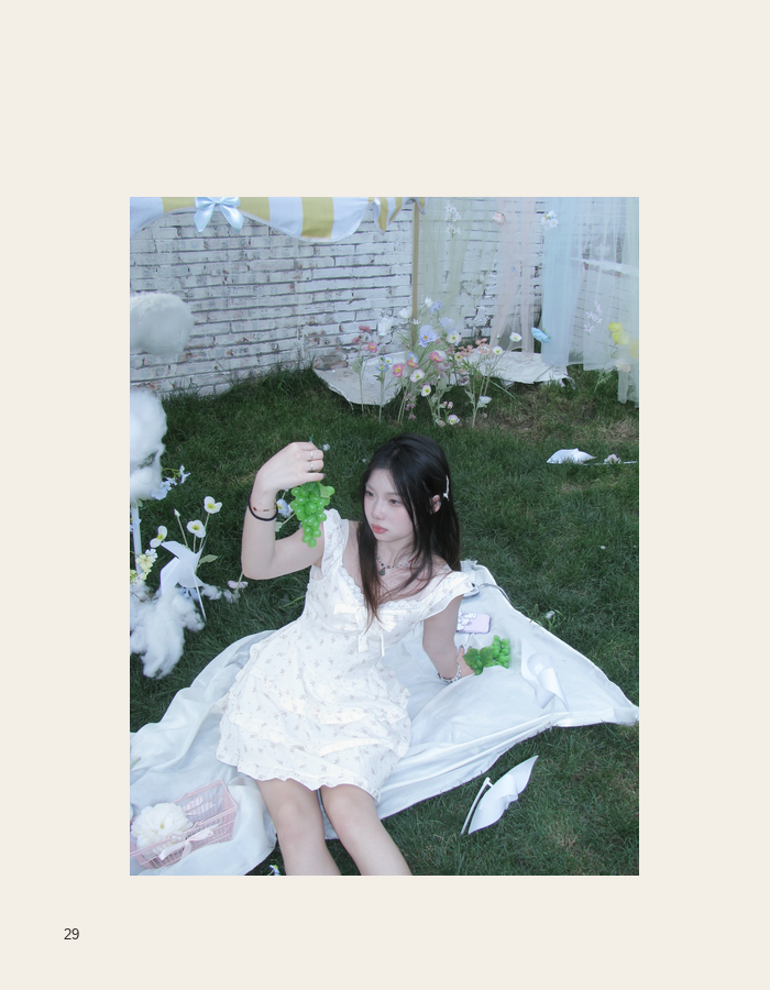 White dress portrait reclining in a garden