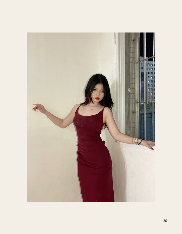 Red dress portrait against a pale wall