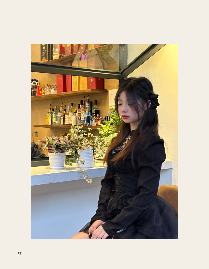 Seated portrait in a warmly lit bar
