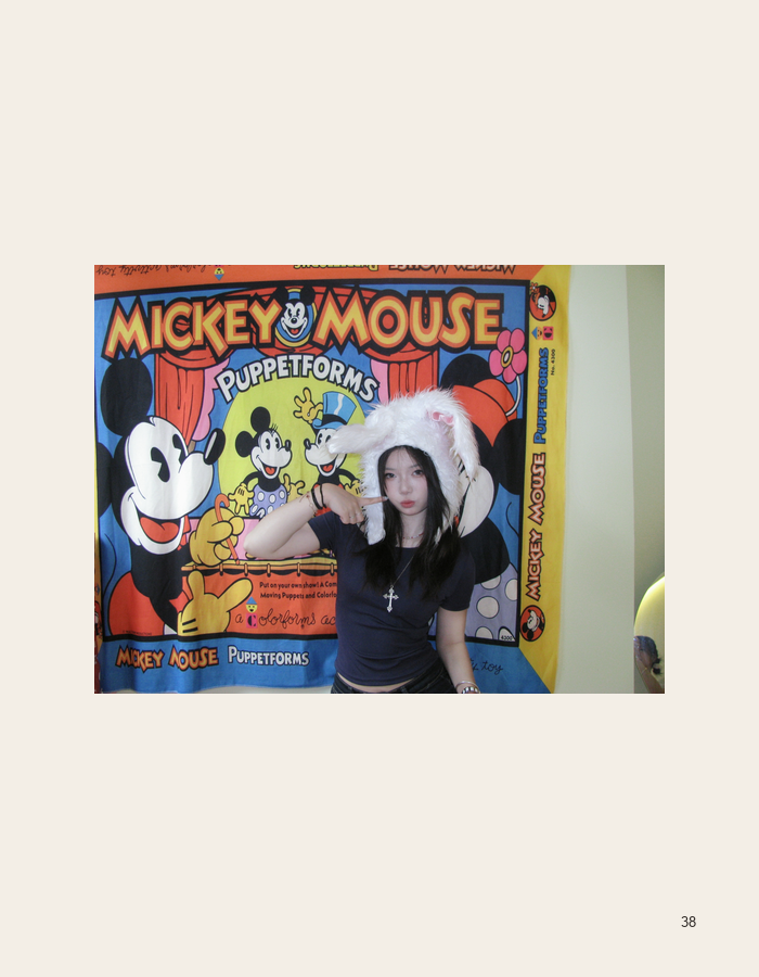 Portrait before a Mickey Mouse mural