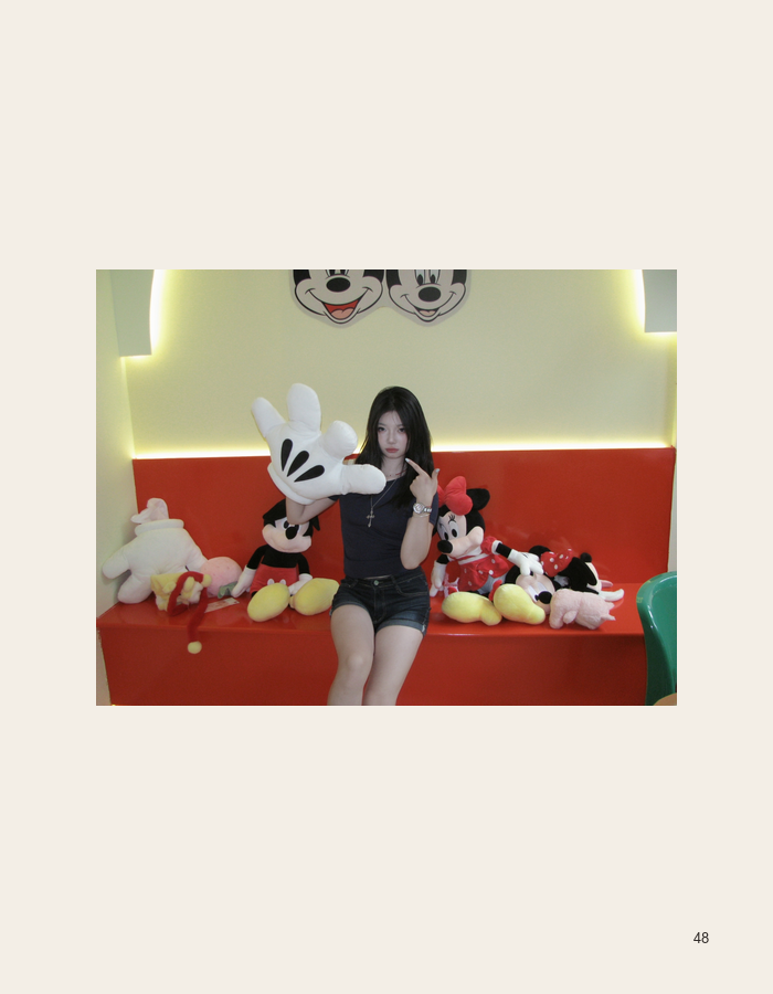 Seated portrait with a Mickey Mouse collection